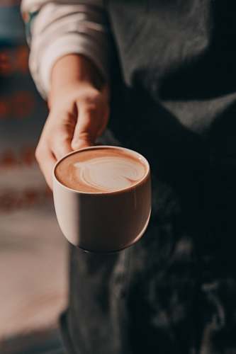 coffee cup person holding brown teacup cup